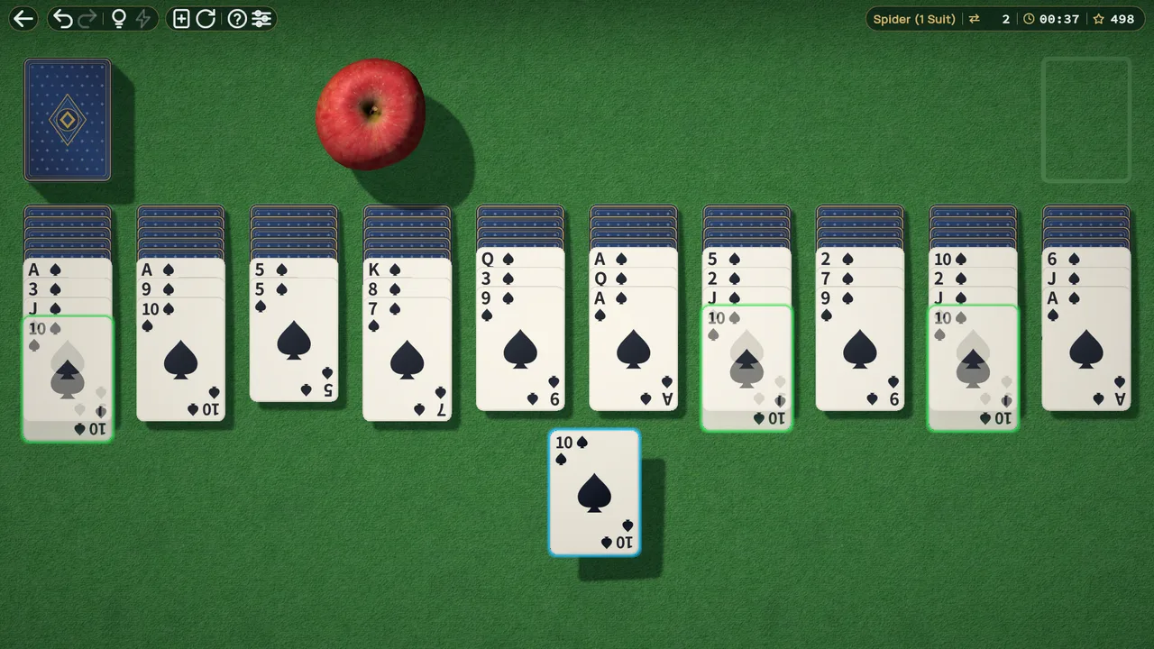 Spider solitaire with cards arranged in ten columns.